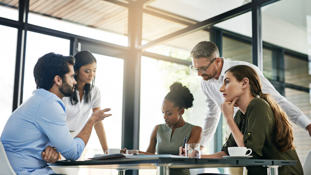 Shot of a group of colleagues working together in an office.